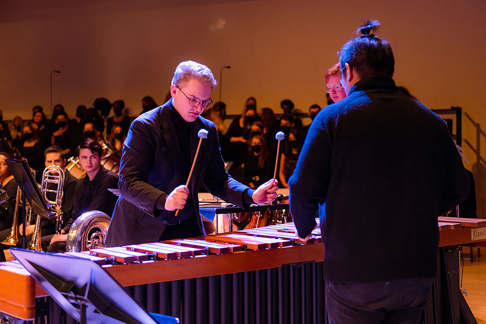 image of male student playing the drums