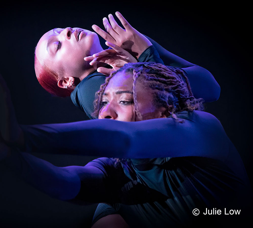 two female dancers embracing