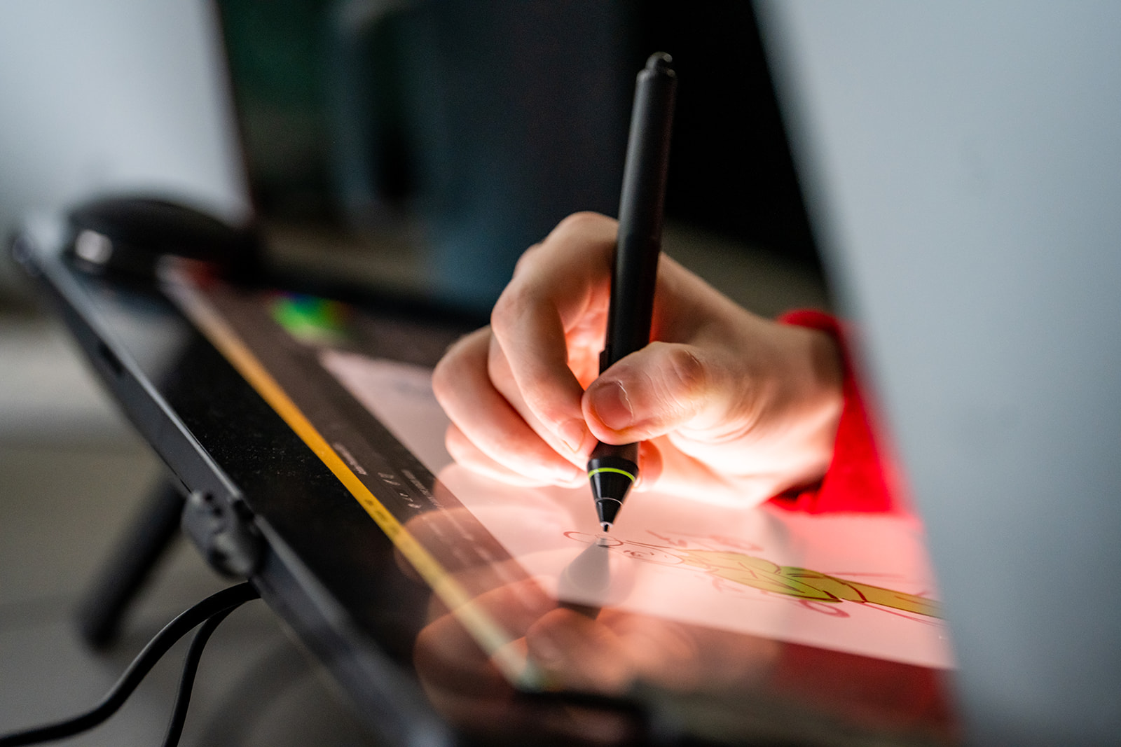 student drawing on wacom tablet