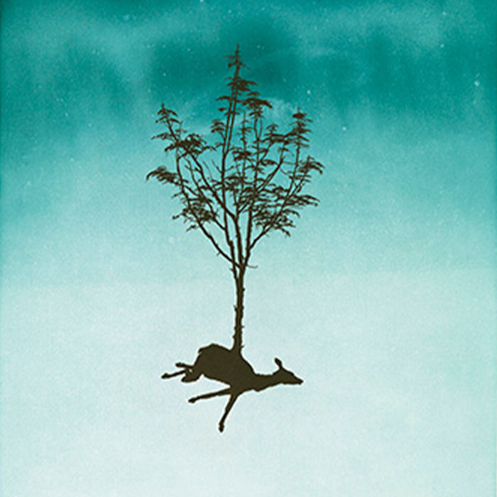 Detail of print by Darren Waterston featuring a teal background fading from top to bottom with speckles that resemble the sky; in the center is a deer-like animal depiction in dark gray with branches of a tree growing from its back. 