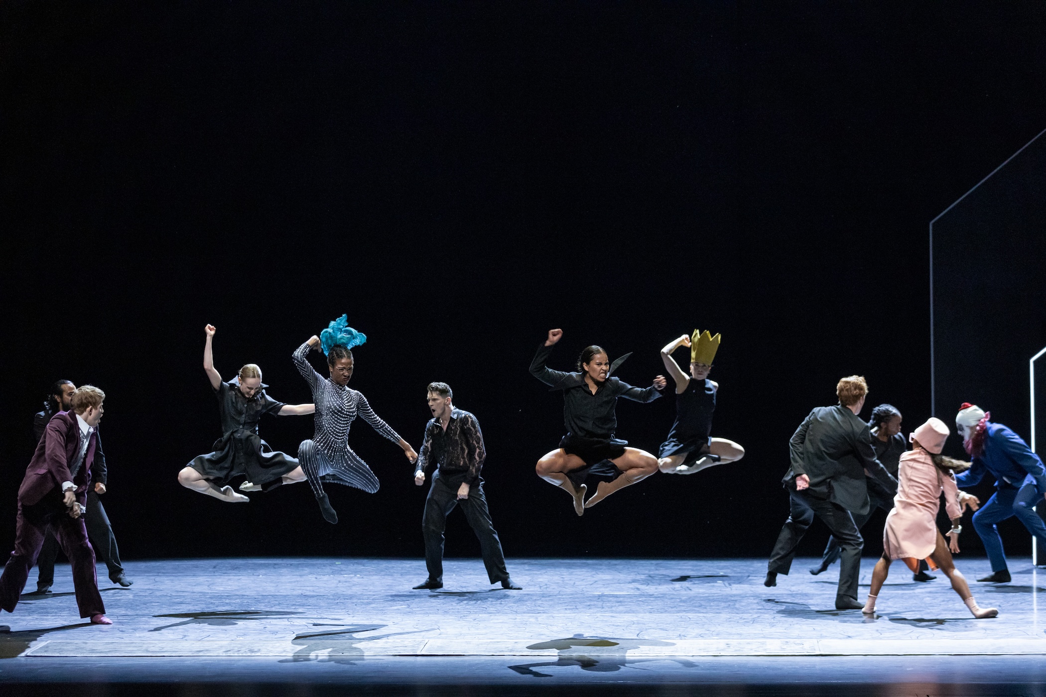 dancers leap in the air