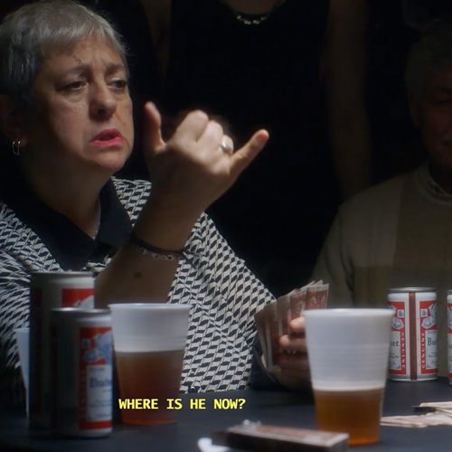 image of woman setting at confernece table