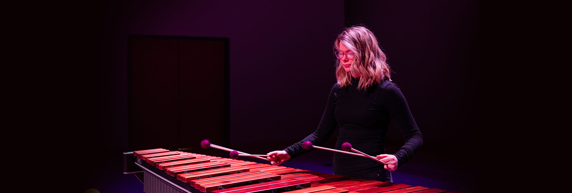 image of woman playing percussion