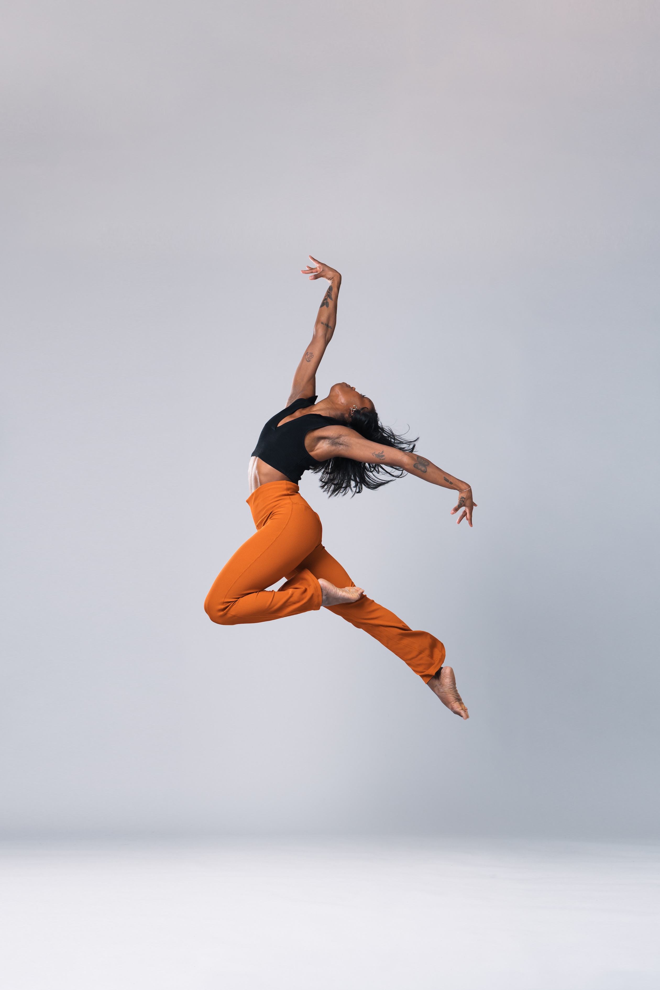 dancer simone stevens leaps into the air
