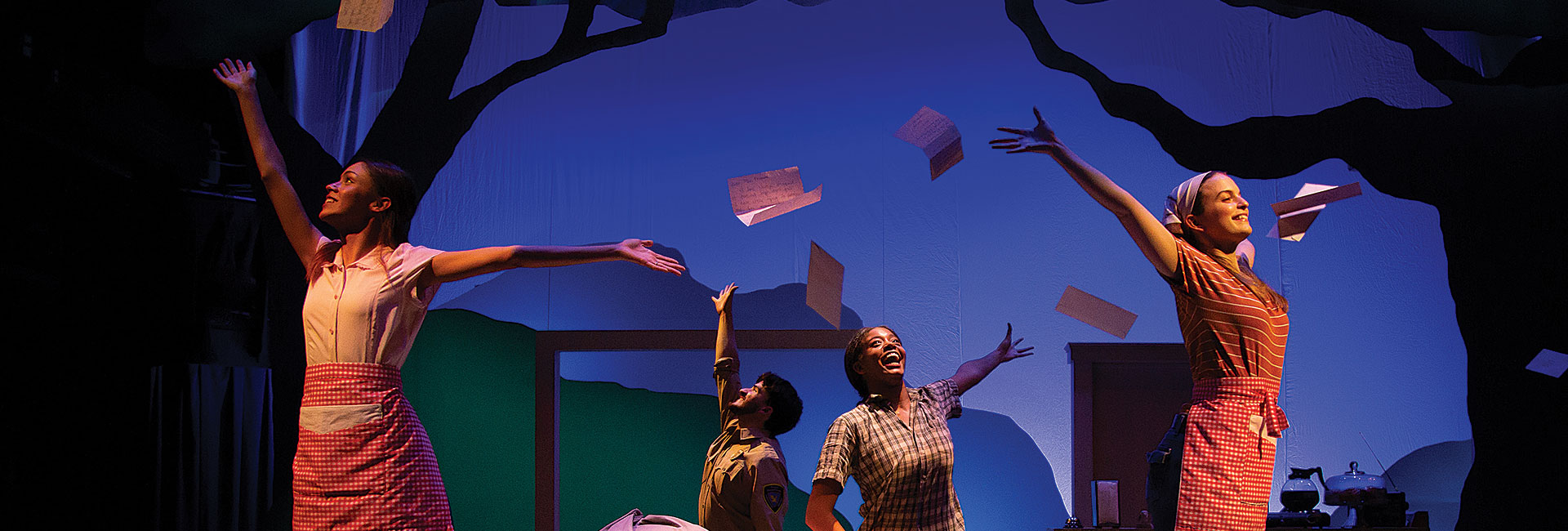 image of wait staff throwing mail in the air from spitfire grill