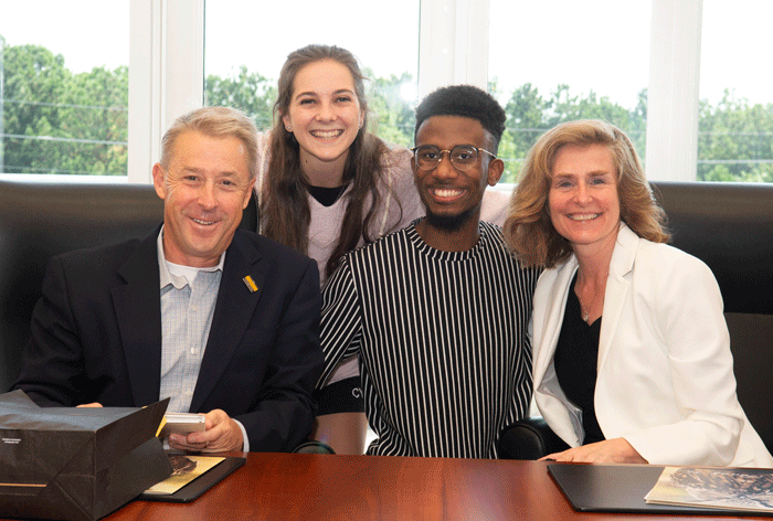 Jay Yunek with two dance students and President Whitten 