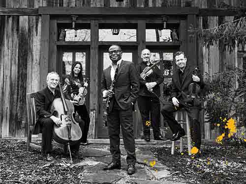 image of Anthony McGill in front of the Pacifica Quartet