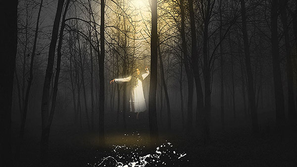 ghostly woman floating in the forest
