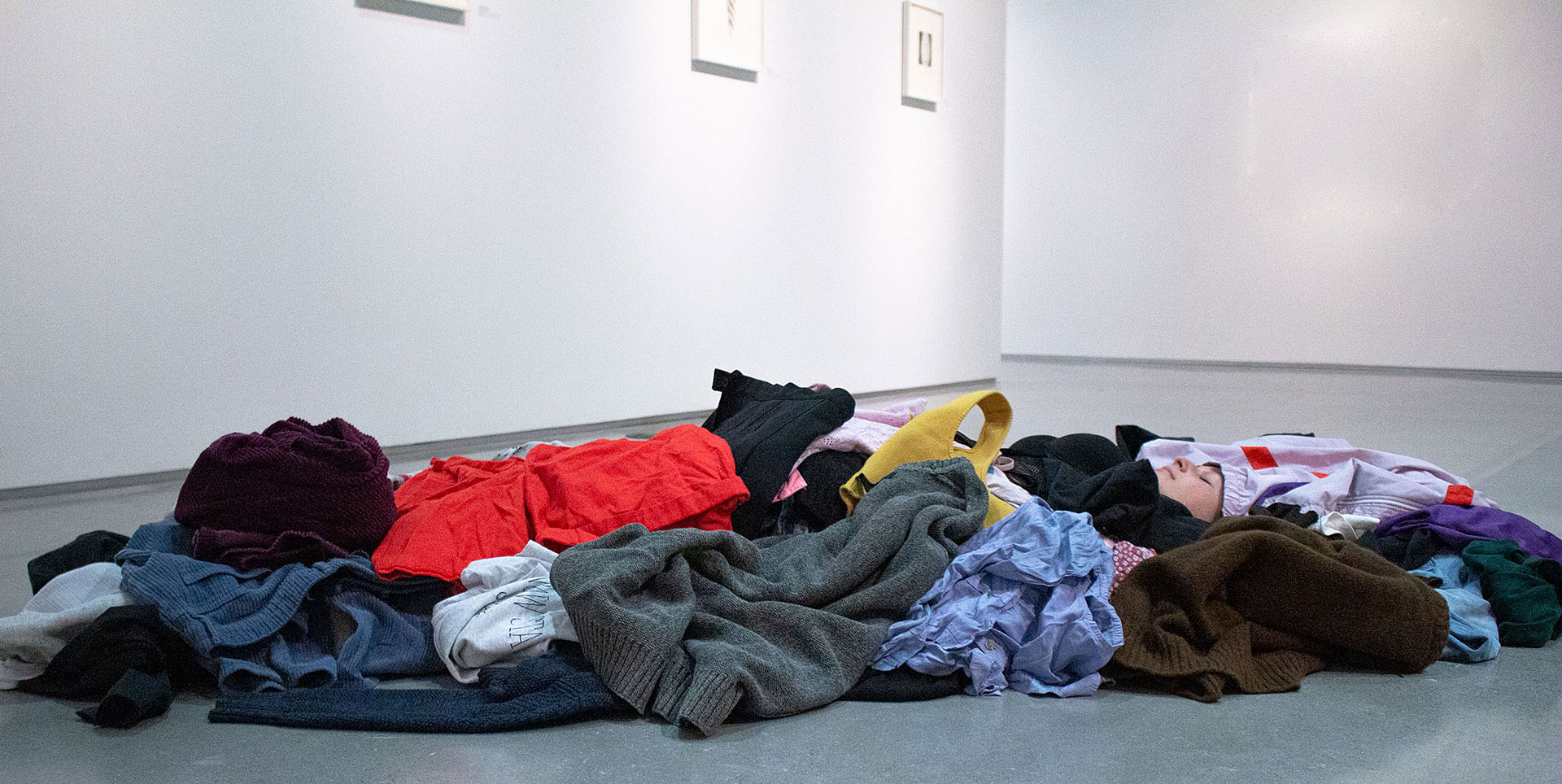 image of dancer laying on floor in clothes