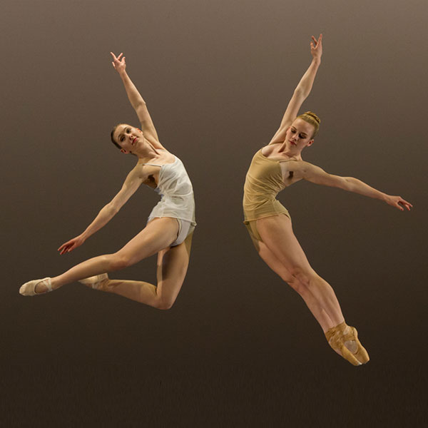 dancers jumping legs extended