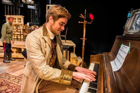 Hayden Rowe, playing Andrey, practices the piano during rehearsal. Photo credit: Cory Hancock