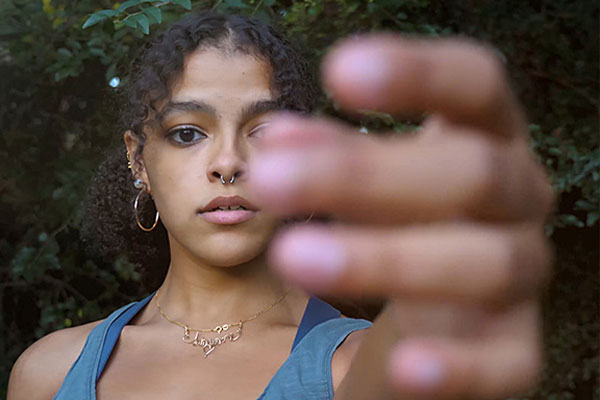 image of Simona Lucchi with hand in front of face