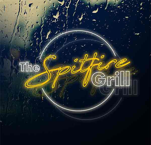 image of neon spitfire grill on rainy window