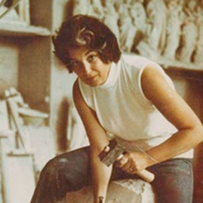 Image of Ruth V. Zuckerman carving a stone sculpture