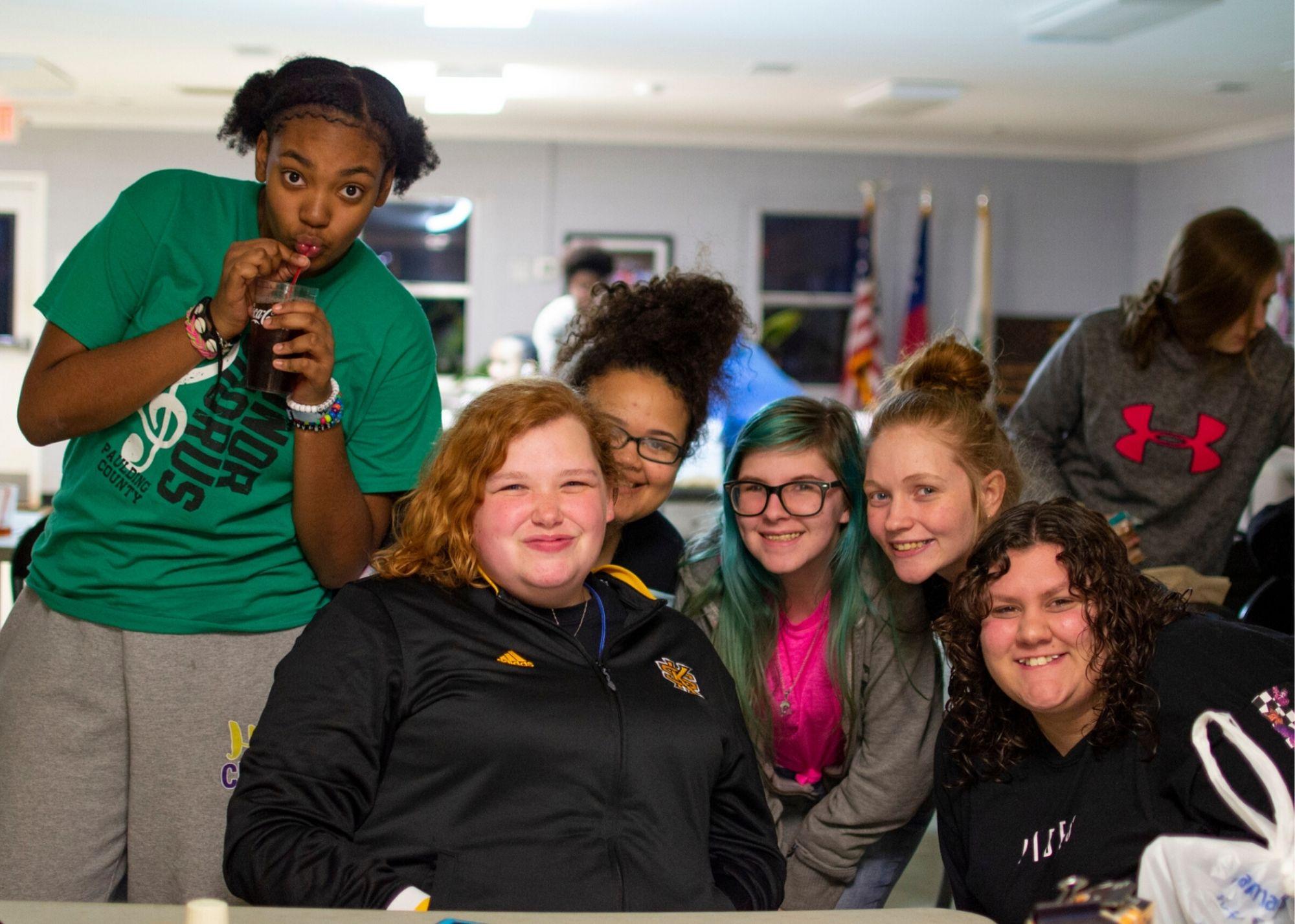 Women smiling while attending a Women's Empowerment Conference / KSU TRiO holds a Women's Empowerment Conference to provide a space space for women to learn and grow.