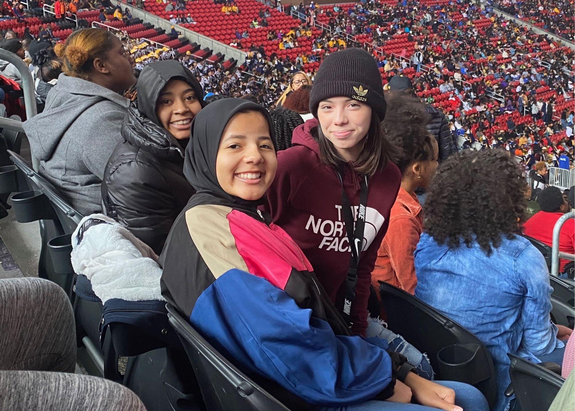 Students attending an outdoor sporting event / 
