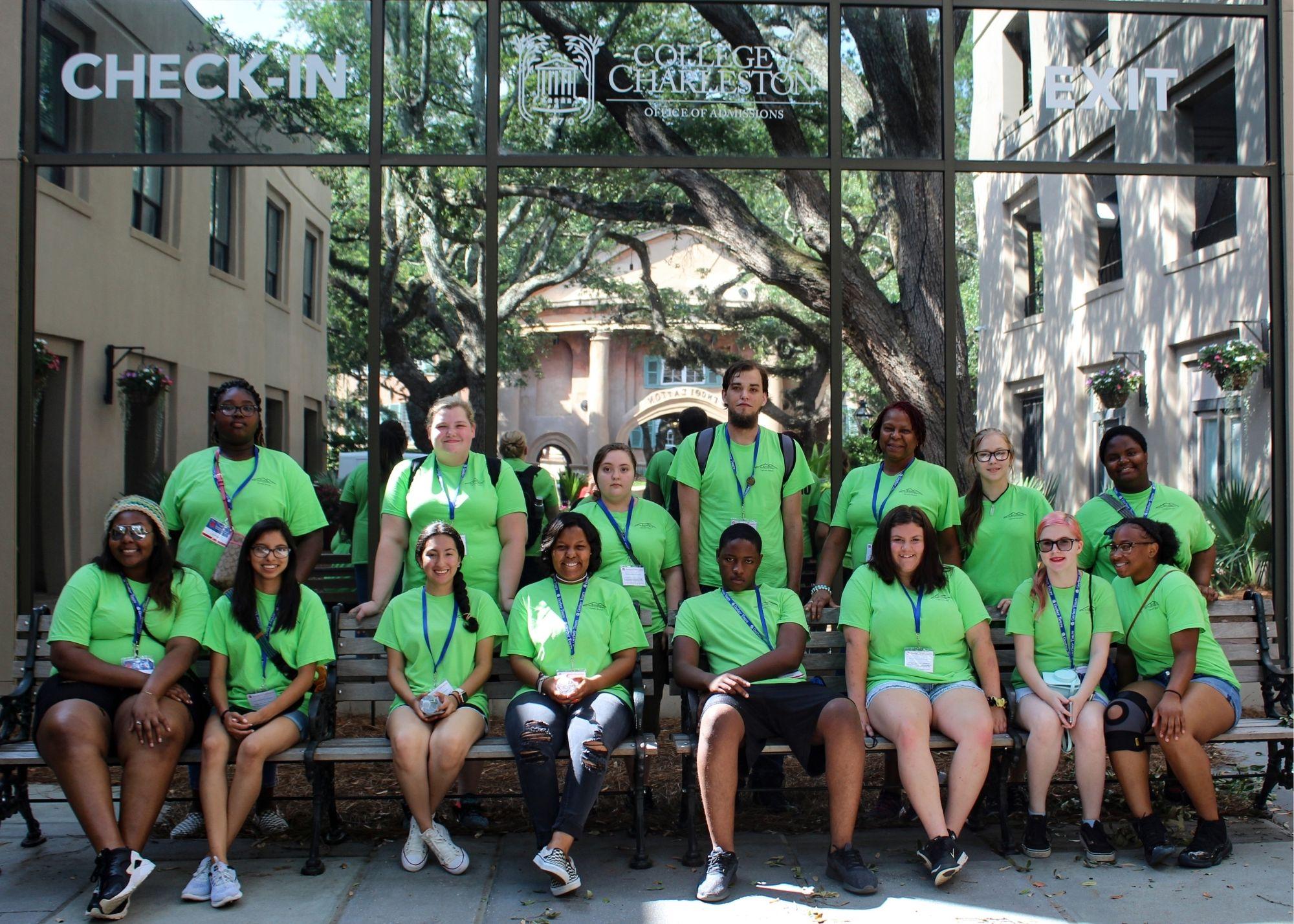 Students wearing green shirts posing for a picture in an outdoor setting. / KSU TRIO Students have the opportunity to go on an out of state, educational field trip after full participation in the KSU TRiO Summer Academy. The trip is provided at no cost to students.