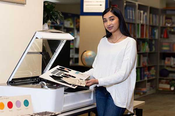 future teacher using instructional technology in the library