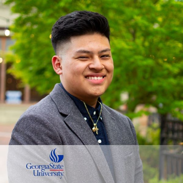 Angel Bohorquez Cortez, smiling in a headshot in an outdoor setting, with the Georgia State University logo in the bottom left corner.