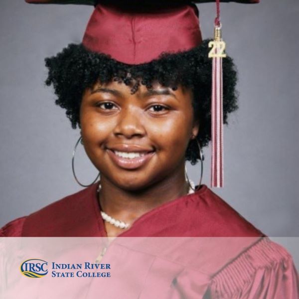 Aniaya Grace, a graduate wearing a cap and gown, with the Indian River State College logo in the bottom left corner.
