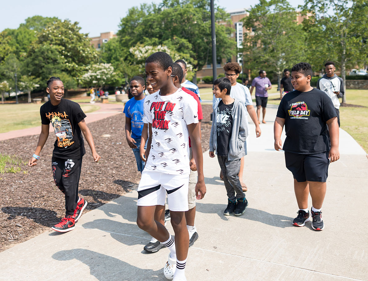 KSU Future MISTERs Academy students walking on campus.