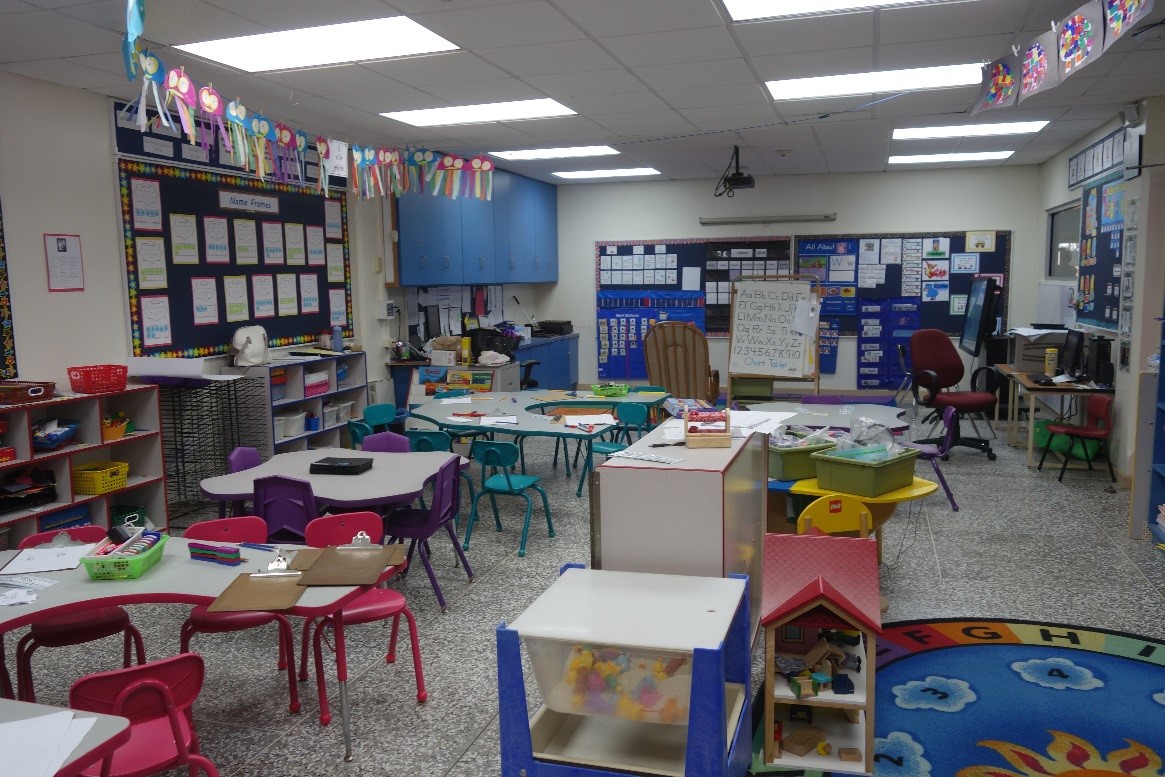 The Education classroom at the International School of Port of Spain, showcasing multiple tables and chairs for collaborative learning.