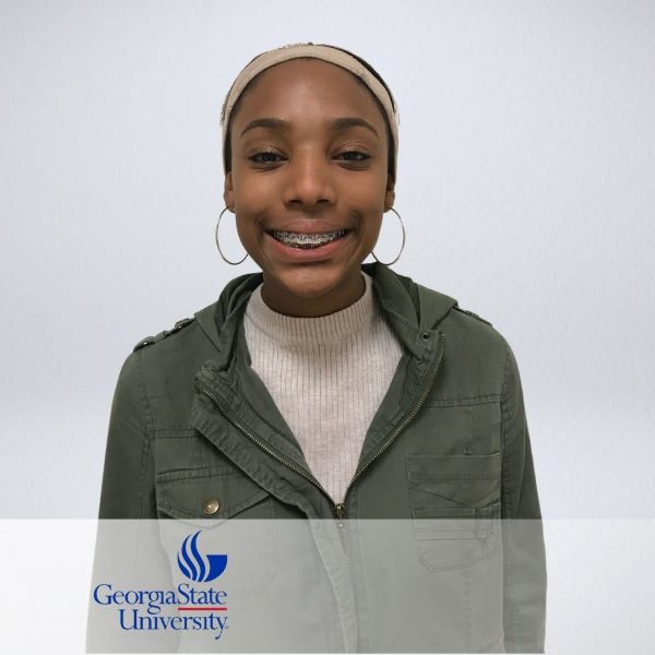 Alyssa Johnson, smiling in a headshot with a neutral background.