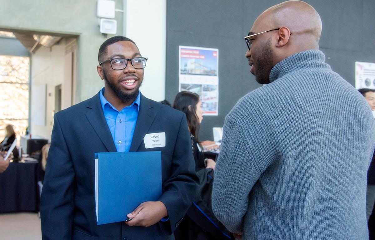  / Prospective employer speaking with future employee. Department of Architecture at KSU Annual Firm Networking Fair.