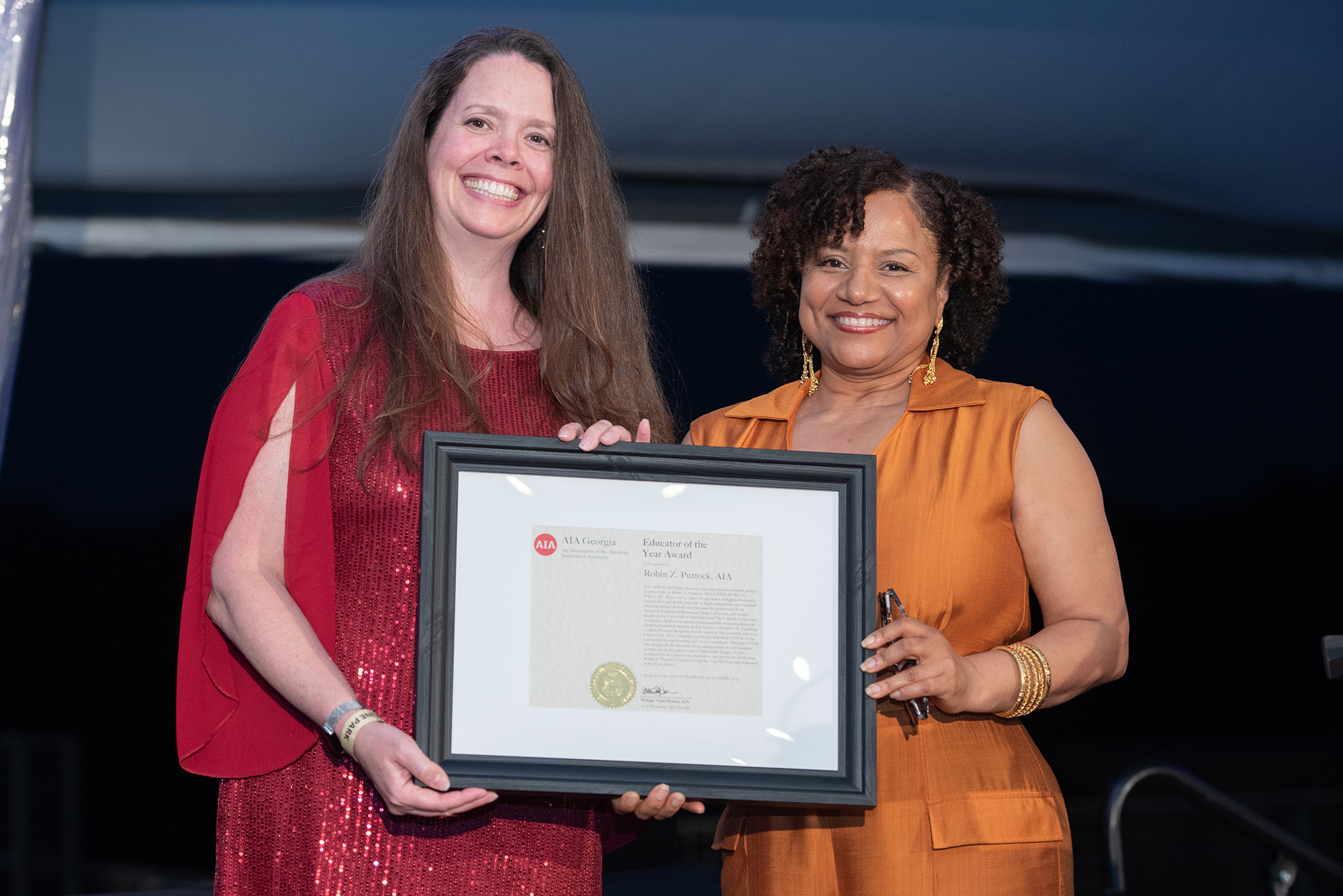 Professor Robin Puttock smiling as she receives the award for AIA Georgia Educator of the Year. 
