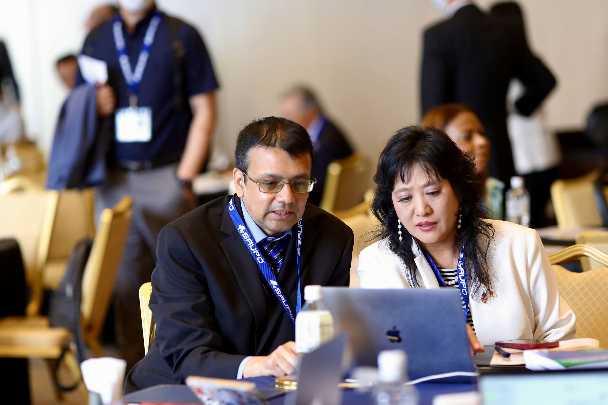 Professor Sanjeev Adhikari conversing with a colleague.