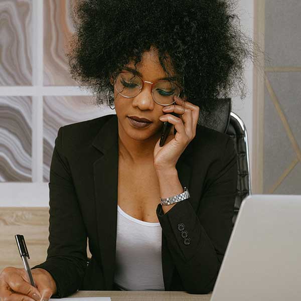african american lady on phone in office