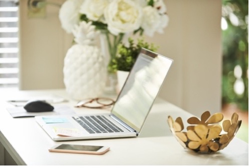 laptop sitting on top of a table.