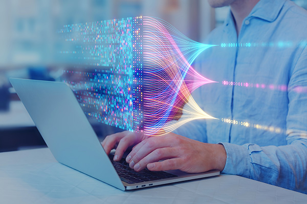 Student in Computer Science Creating Coding String on a Laptop