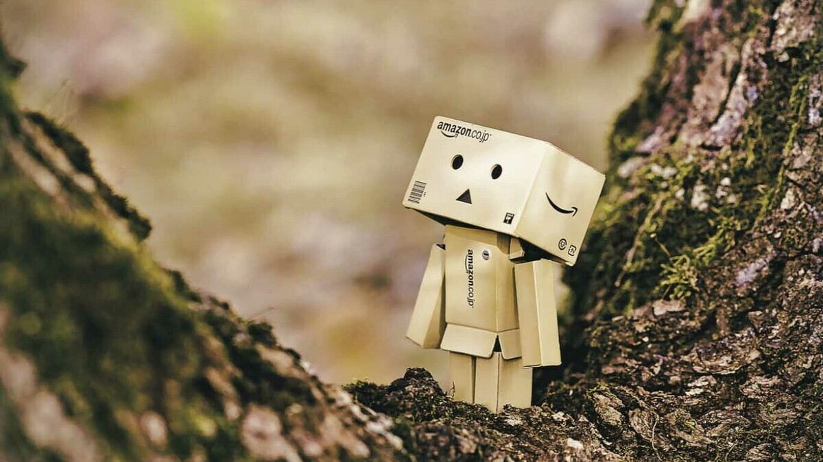 A cardboard box character standing in a tree.