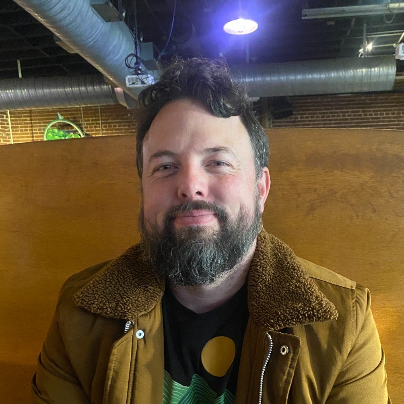 Game designer Ryan Langley smiles.