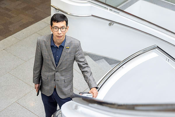 Dr. Lei Li, IT Department Interim Chair, photographed in stairwell