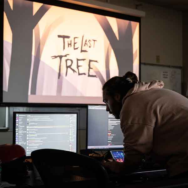 KSU student presenting their game "The Last Tree".