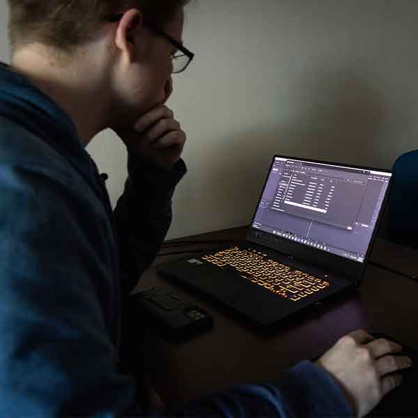 KSU Software engineering student using their laptop.