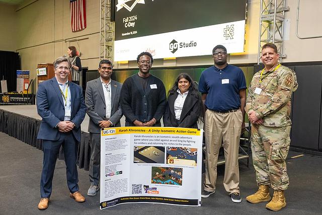 A picture of the project that won the Audience Favorite Presenter award, UC-131 Karah Khronicles, an Undergraduate Project by Dion Green, Jake Stipetich, Grace Bowe, Jesse Isreal, and Vedasri Malatker.
