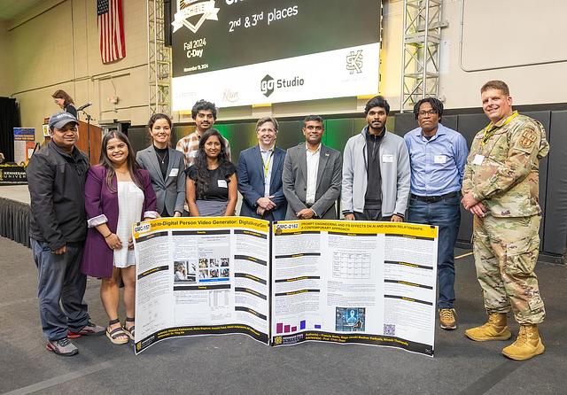 A picture of the second and third place winners for Graduate Projects. Second place is GMC-2162 Prompt Engineering and Its Effects on AI and Human Relationships: A Contemporary Approach and its authors. Third place is GMC-157 Text-to-Digital Person Video Generator: DigitalAvatarGen and its authors