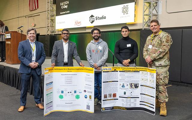 A picture of the second and third place winners for the PhD Research category. Second place is GPR-1194 Computer Vision-Enhanced Spectroscopy for Glucose Prediction: An In Vitro Validation Study by El Arbi Belfarsi. Third place is GPR-6126 Utilizing ML Techniques for a Quantum Augmented HTTP Protocol by Nitin Jha.