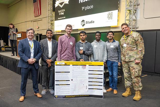 A picture of the first place winner for Undergraduate Research, UR-147 An 8-bit Digital Computer Design & Implementation by Adrian L Sherard, Jesus Flores, Biswash Lamsal, Blake Hammontree and William Pitts.