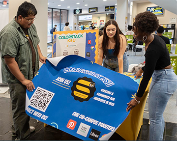 ColorStack, a student organization, sets up their table at community day