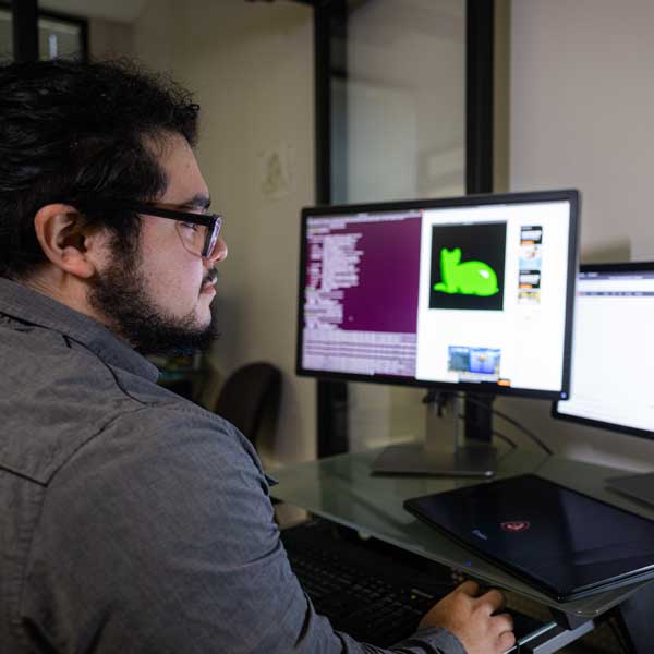 ksu computer science student working on desktop computer