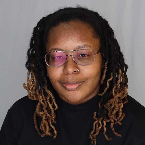 CCSE Communications and Outreach Manager Tru Mitchell smiles.