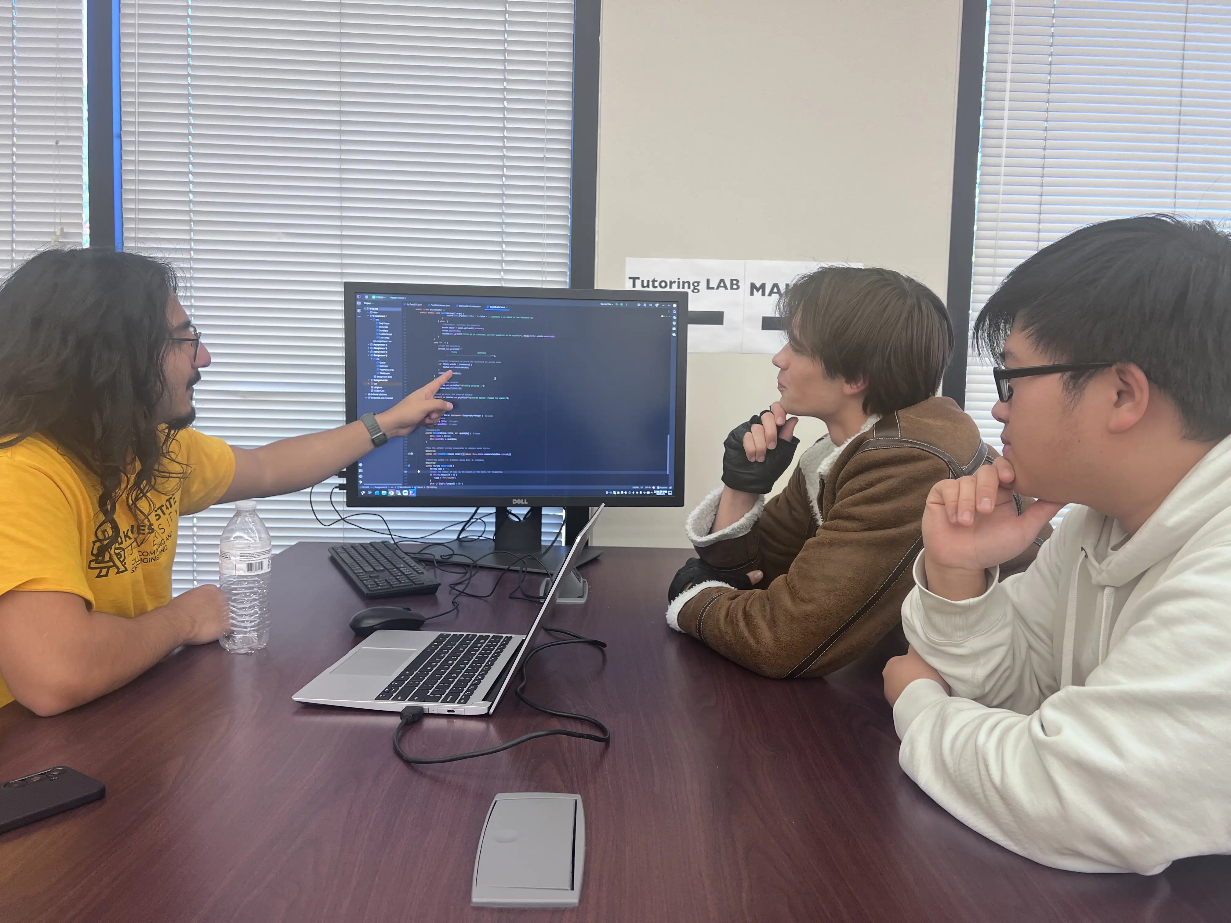 Tutor instructing student.