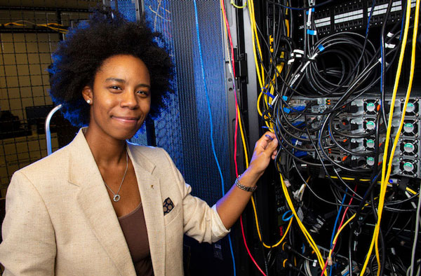 Mizzani Walker-Holmes posing with technology cables. 