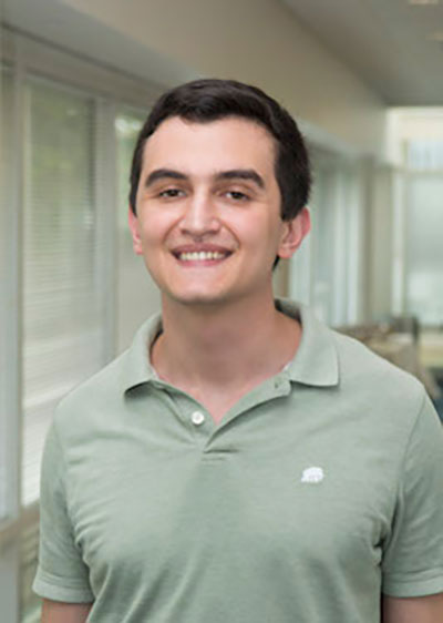 Victor Sahin smiling headshot.