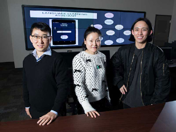 Three ksu students posing in the research lab.