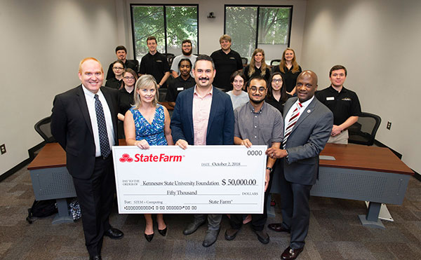 CCSE faculty and students posed with the State Farm grant check.